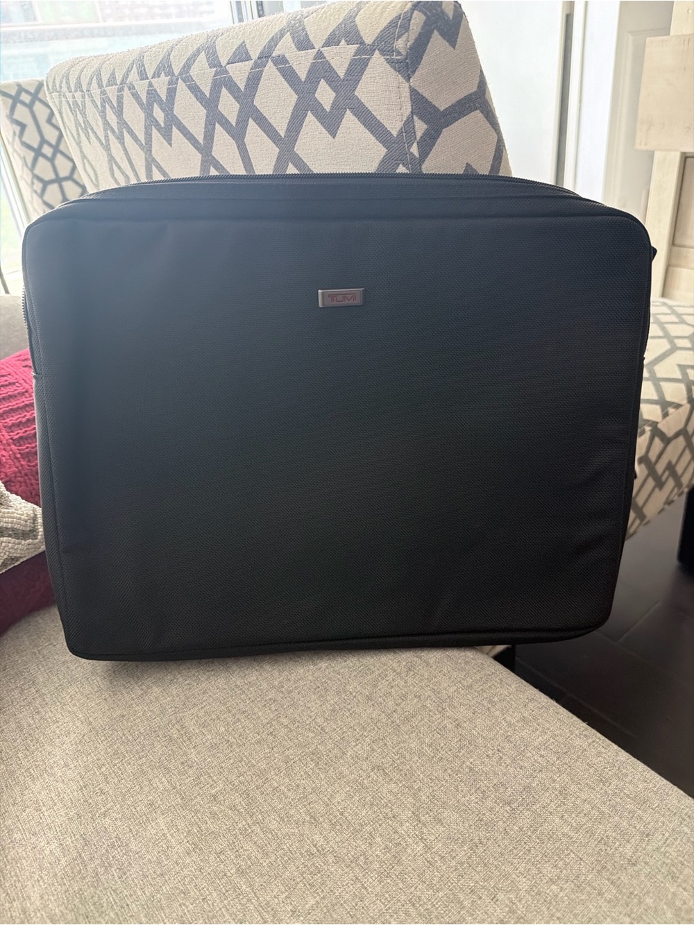 Black Tumi laptop sleeve